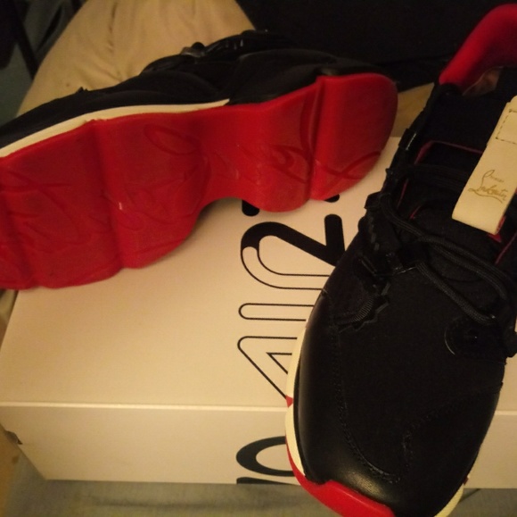 A pair of red bottom sneakers - Picture 5 of 5